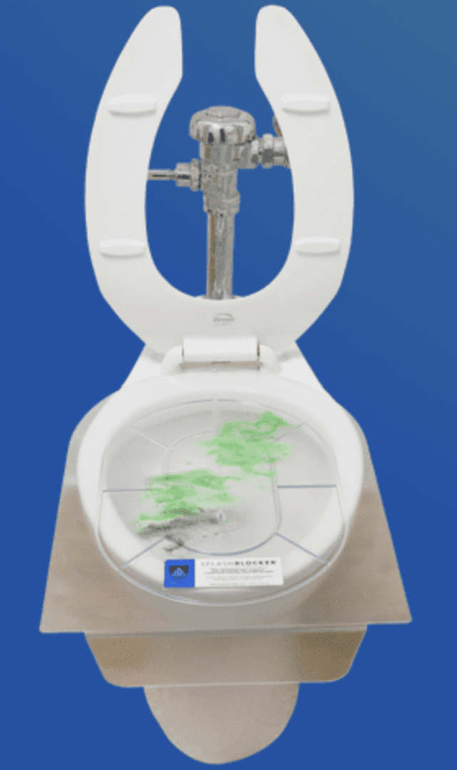 A toilet with green water in it